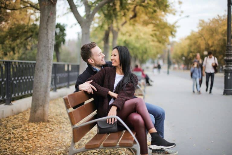 couple talking on park bench